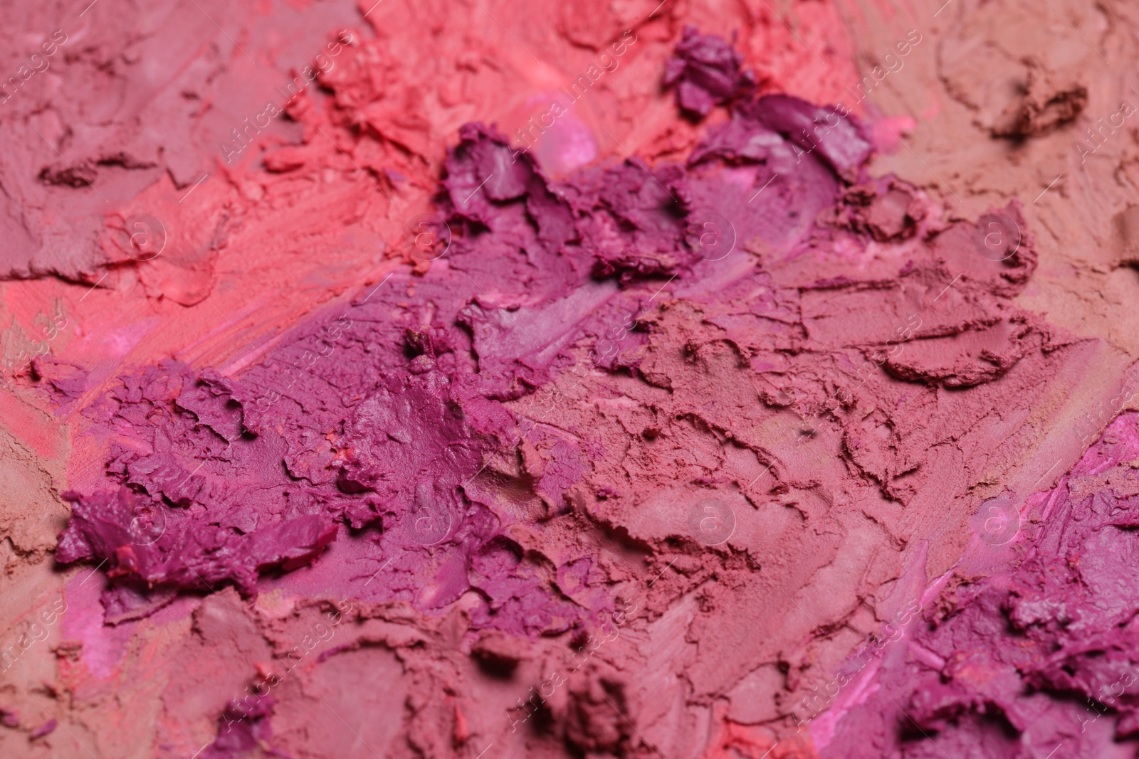 Photo of Texture of beautiful lipsticks as background, closeup