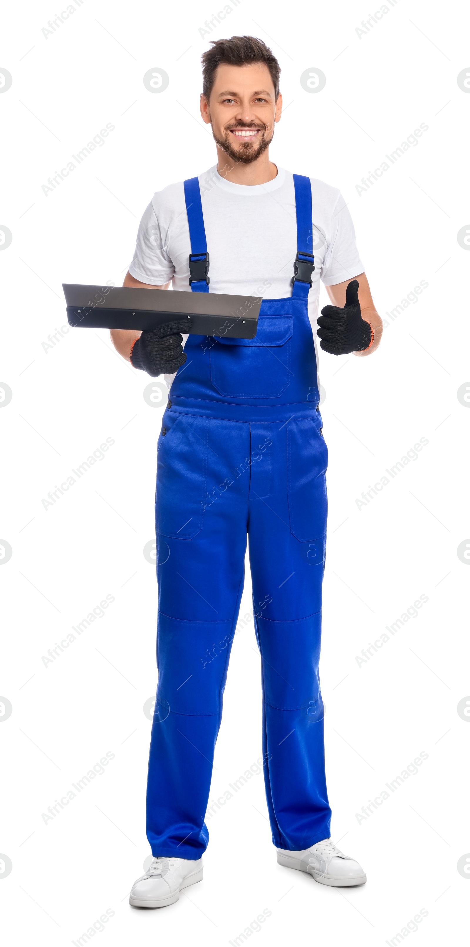 Photo of Professional worker with putty knife on white background