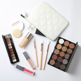 Photo of Makeup bag, cosmetics and accessories on white background, flat lay