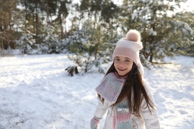 Photo of Cute little girl outdoors on winter day. Christmas vacation