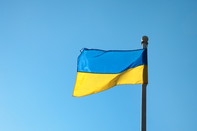 Photo of National flag of Ukraine against clear blue sky