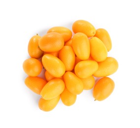 Photo of Fresh ripe kumquats on white background, top view. Exotic fruit