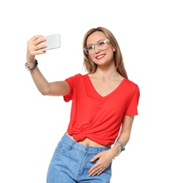 Attractive young woman taking selfie on white background