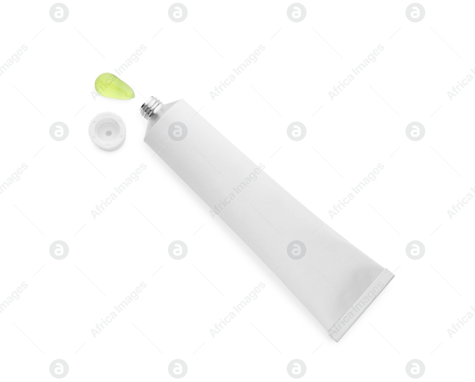 Photo of Open tube with ointment on white background, top view