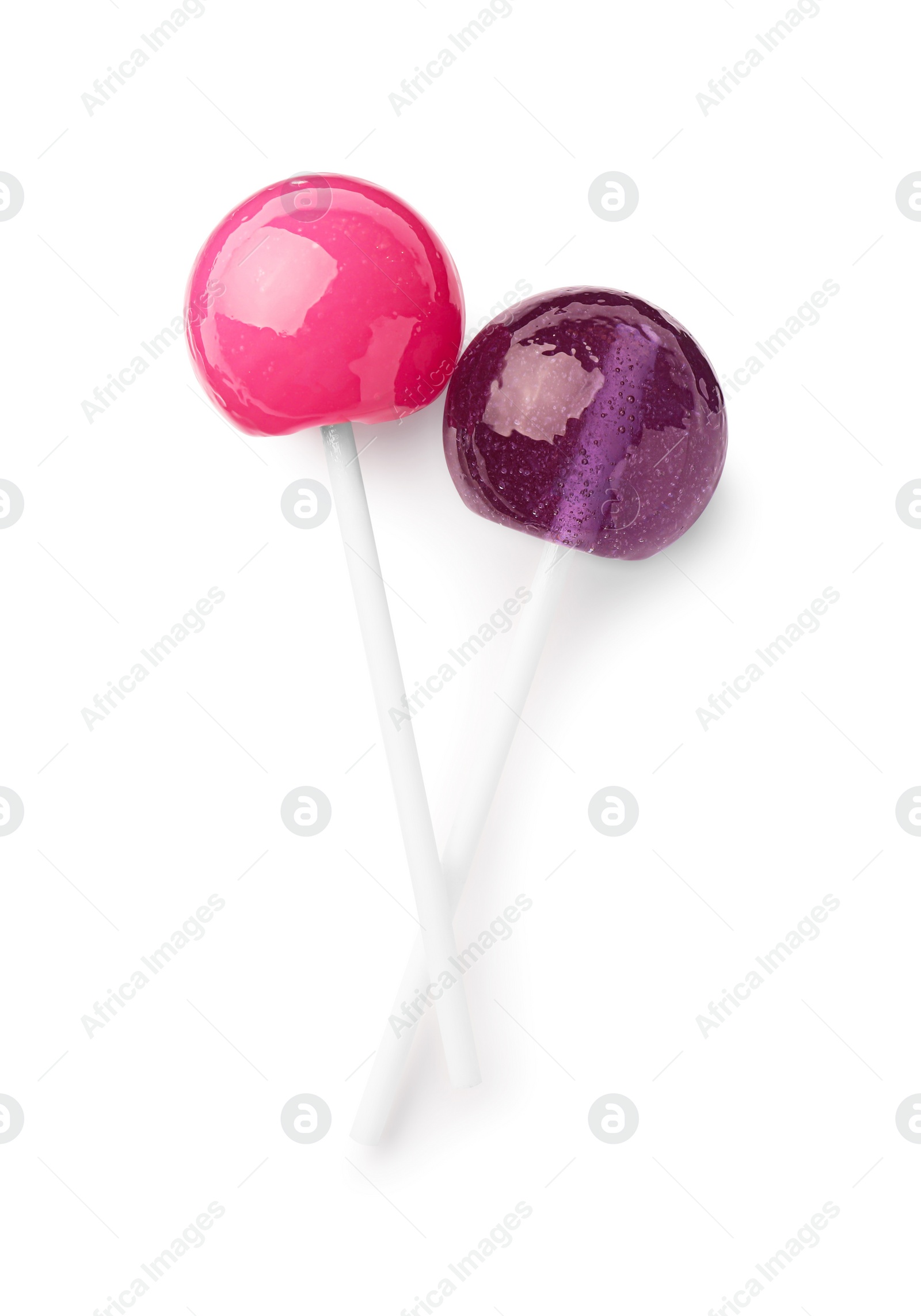 Photo of Two sweet colorful lollipops isolated on white, top view