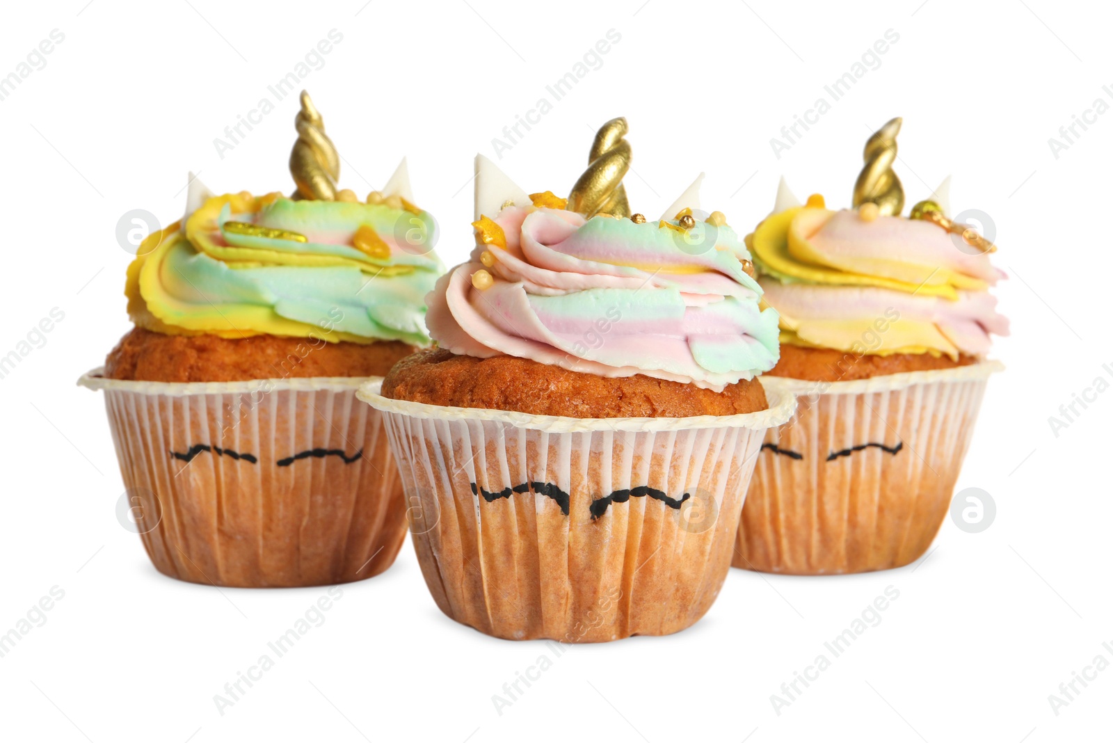 Photo of Cute sweet unicorn cupcakes isolated on white