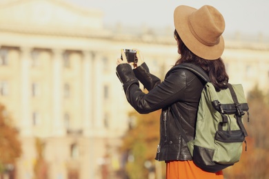 Traveler with photo camera on city street