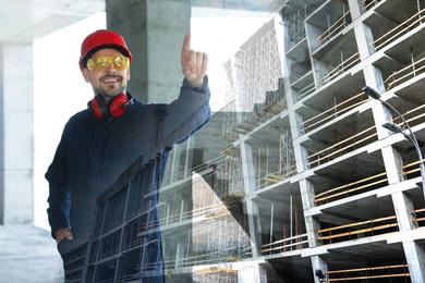Image of Double exposure of engineer at construction site and unfinished building