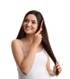 Beautiful young woman with hair comb on white background