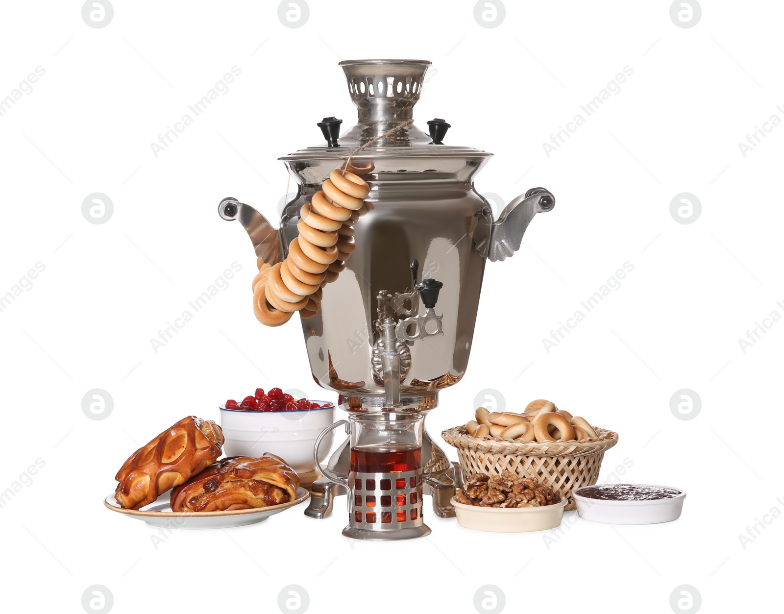 Photo of Traditional Russian samovar with treats isolated on white