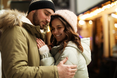 Lovely couple on city street. Winter vacation