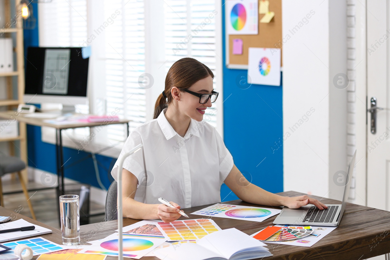Photo of Professional interior designer at workplace in office