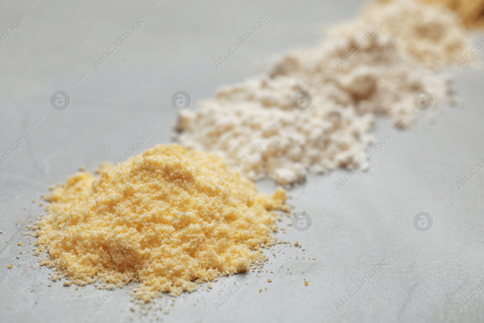 Photo of Pile of corn flour on table, closeup