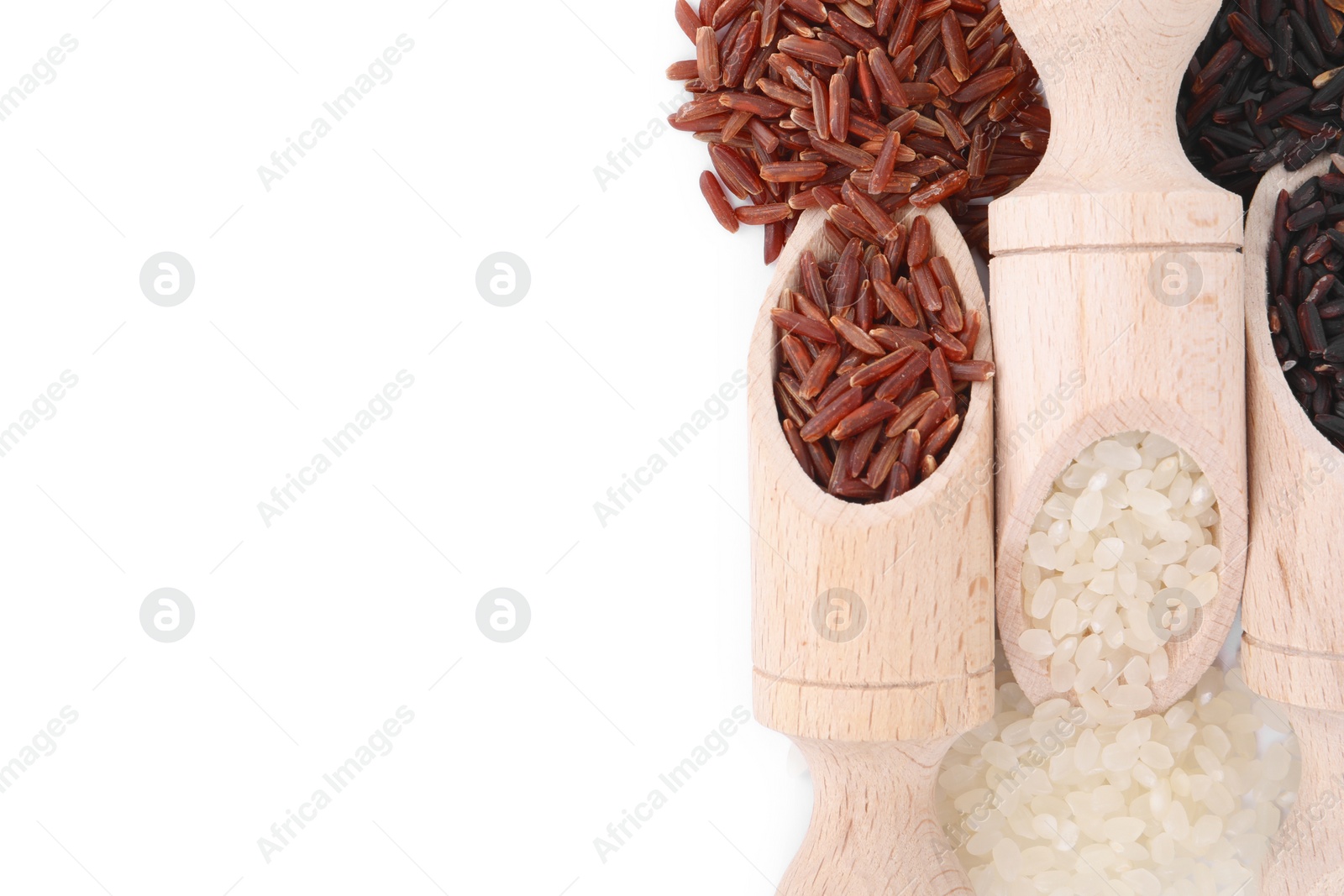 Photo of Scoops with different sorts of rice isolated on white, top view