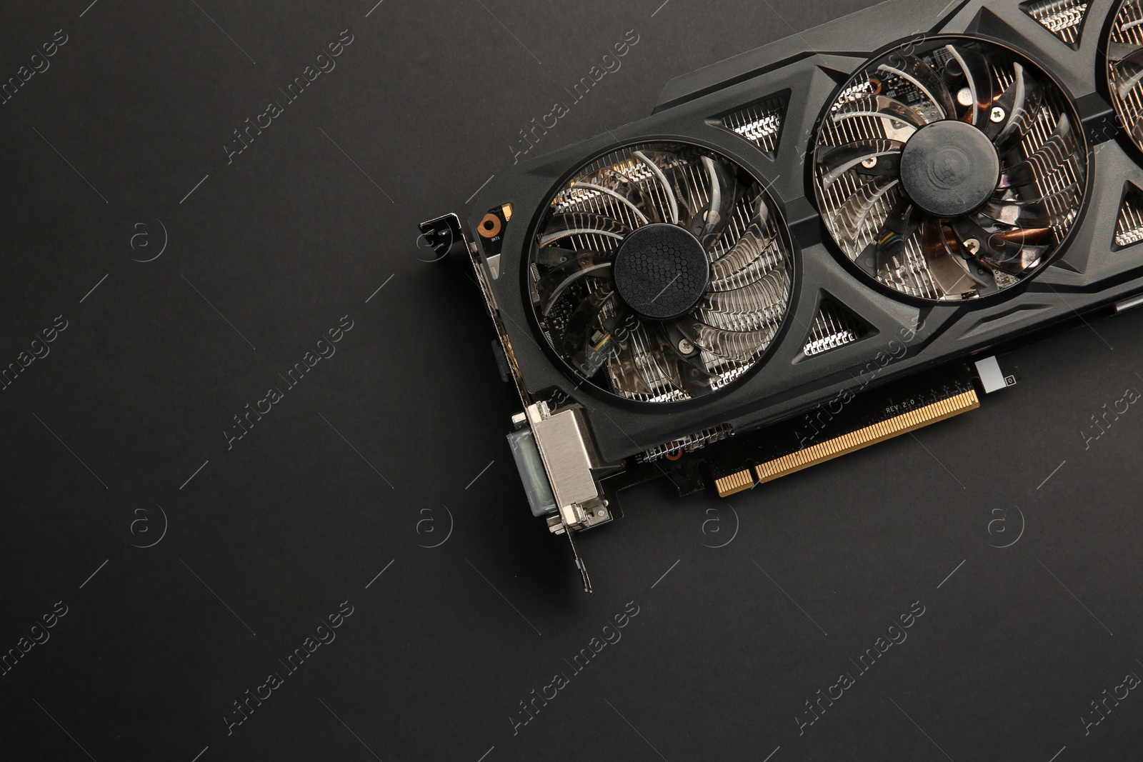 Photo of One graphics card on black background, top view. Space for text