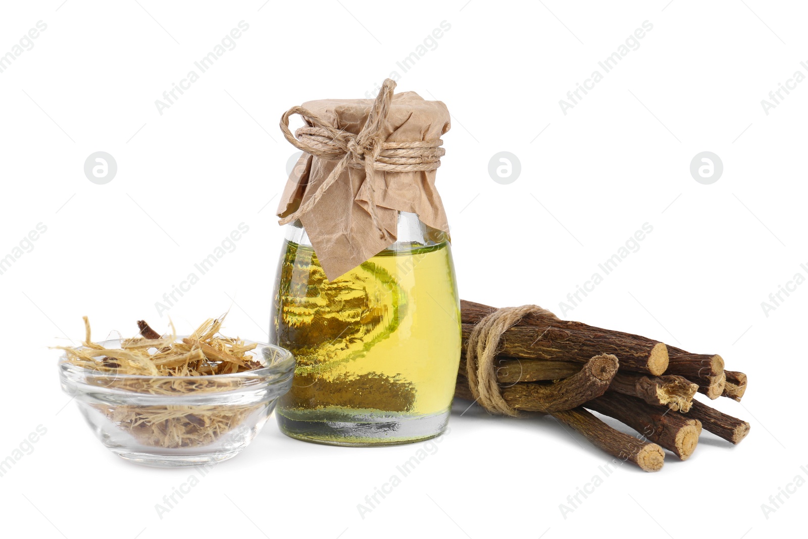 Photo of Dried sticks of licorice root and essential oil isolated on white