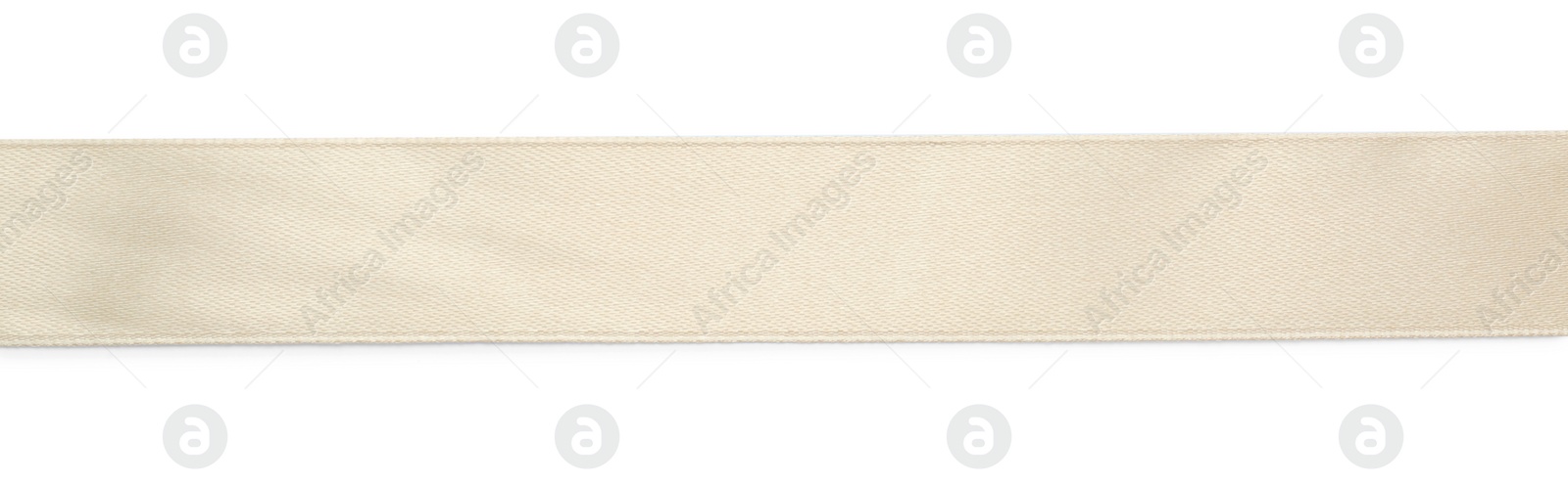 Photo of Beautiful beige ribbon isolated on white, top view