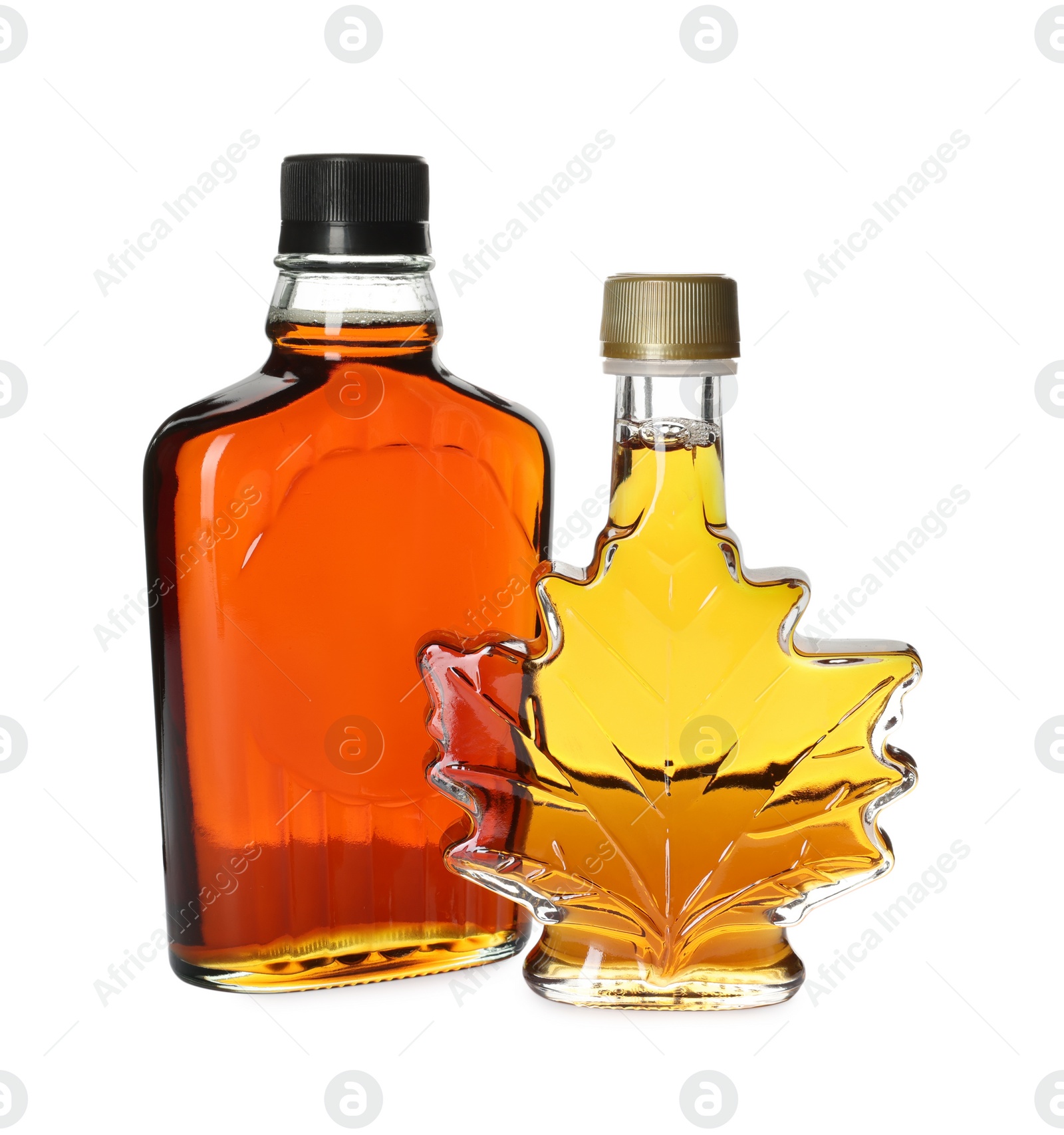 Photo of Different bottles of tasty maple syrup on white background