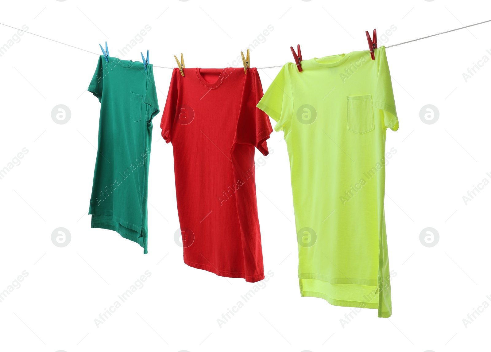 Photo of Colorful t-shirts drying on washing line isolated on white