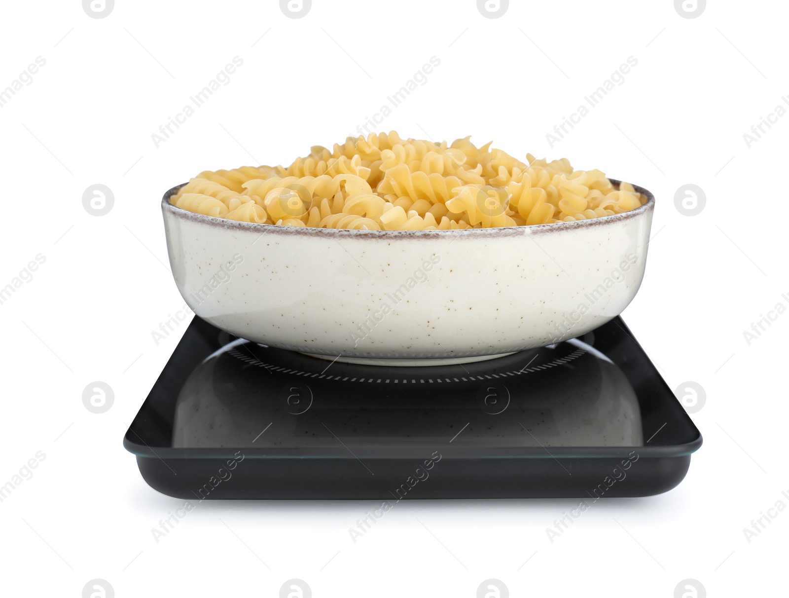 Photo of Modern kitchen scale with bowl of raw pasta isolated on white