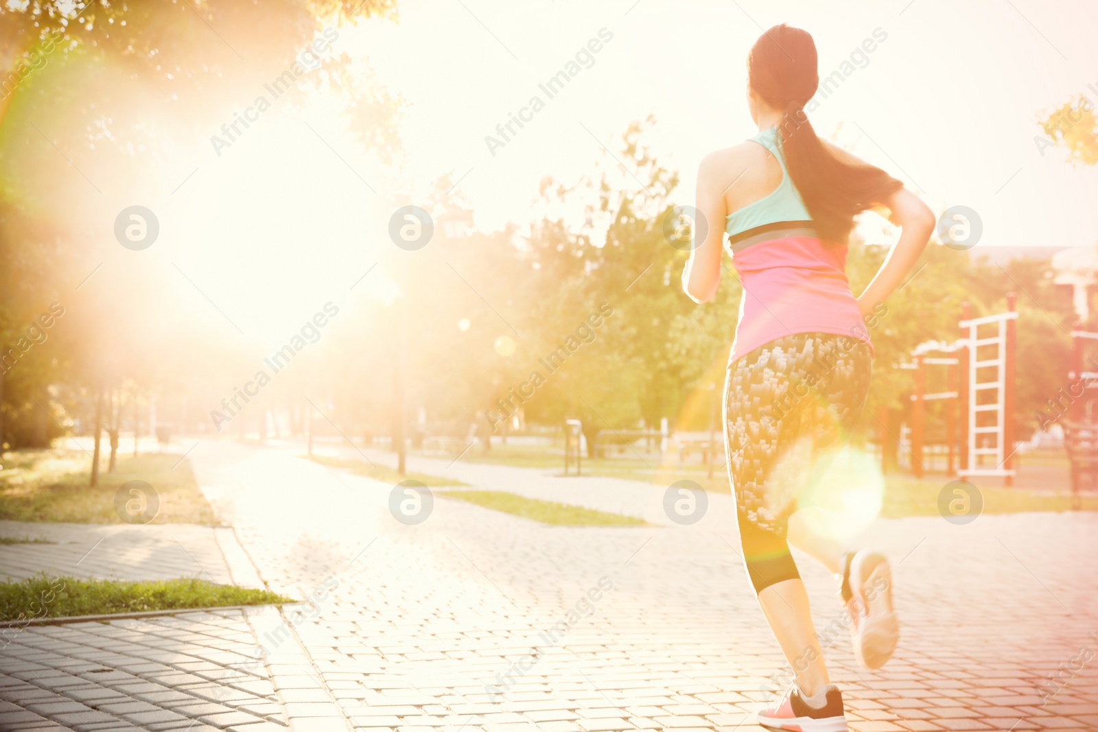 Photo of Young woman on morning run in park