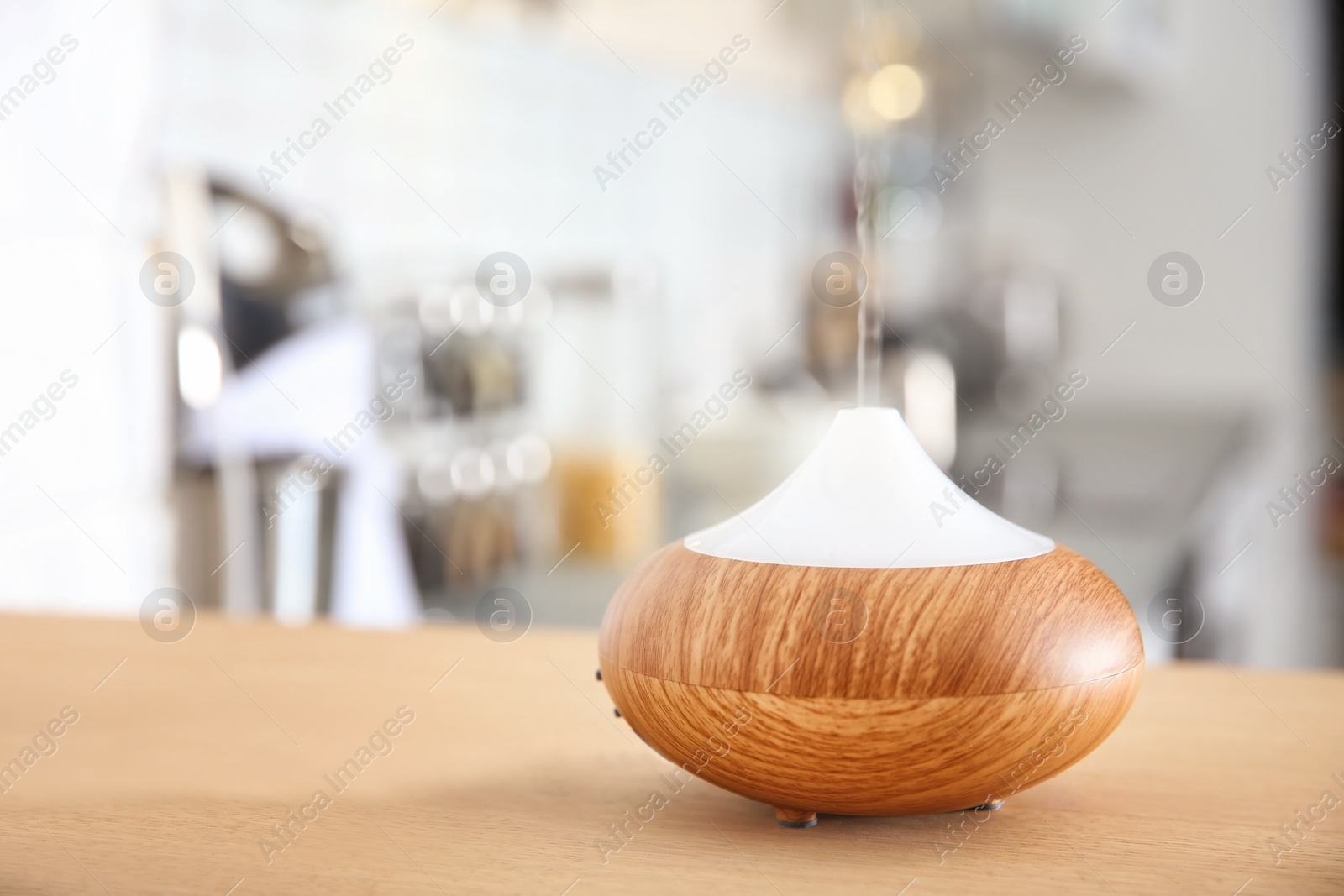 Photo of Aroma oil diffuser on table indoors