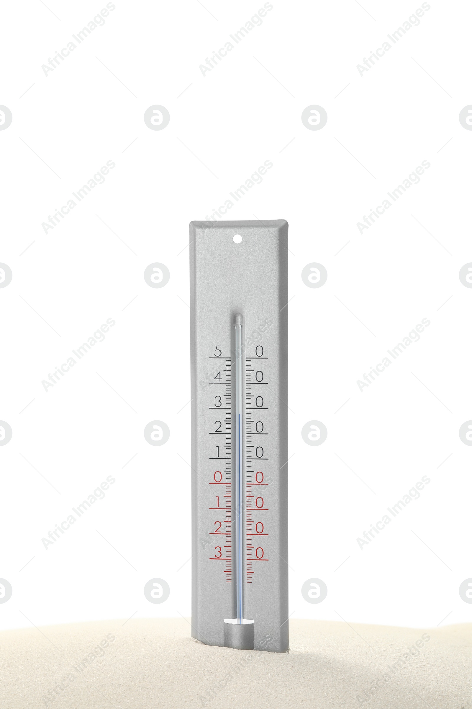 Photo of Weather thermometer in sand against white background