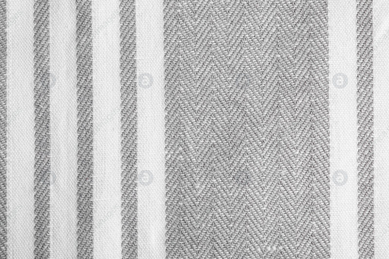 Photo of Texture of grey striped fabric as background, closeup