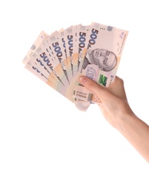 Photo of Woman holding Ukrainian money on white background, closeup