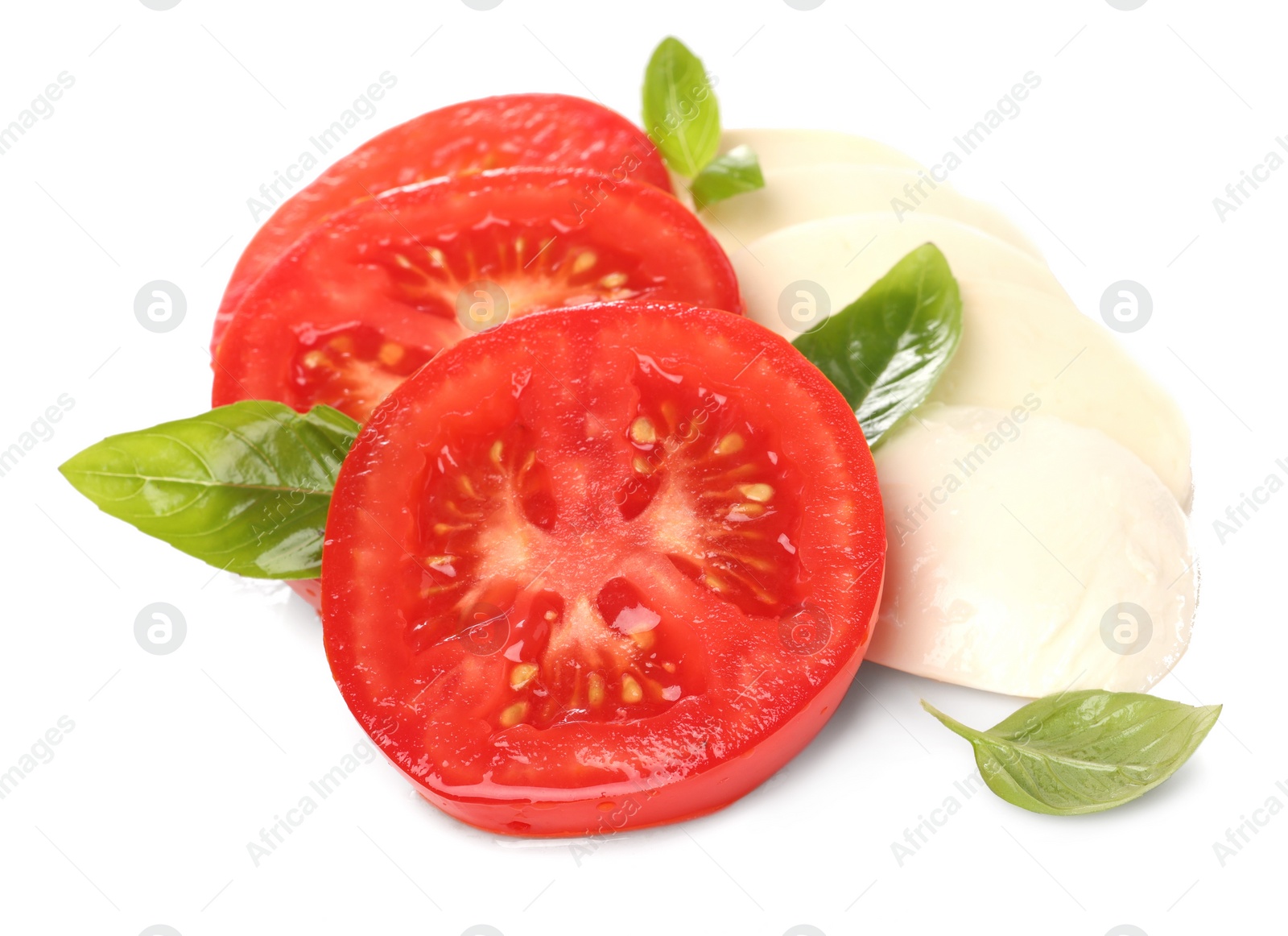 Photo of Delicious Caprese salad with tomatoes, mozzarella cheese and basil leaves isolated on white