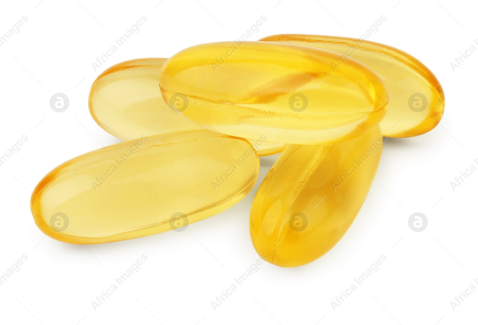 Photo of Many yellow vitamin capsules isolated on white