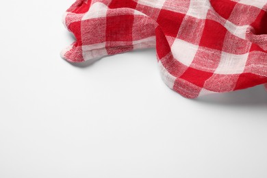 Photo of New red checkered tablecloth on white background