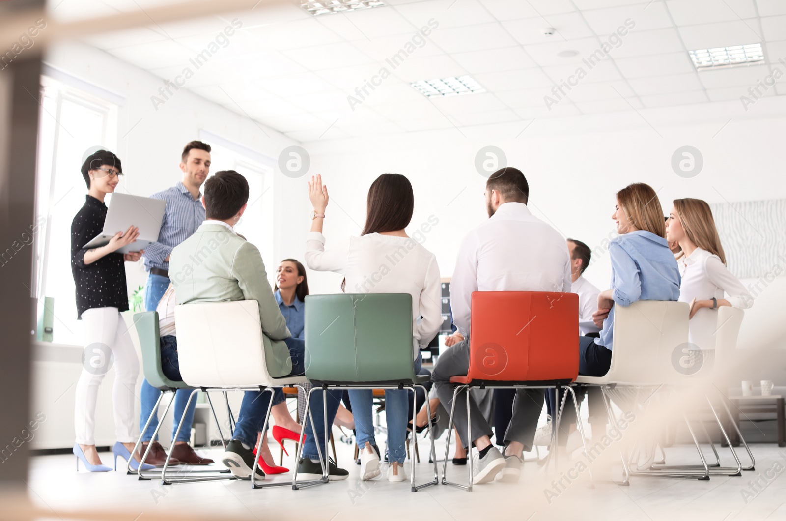 Photo of Young people having business training in office