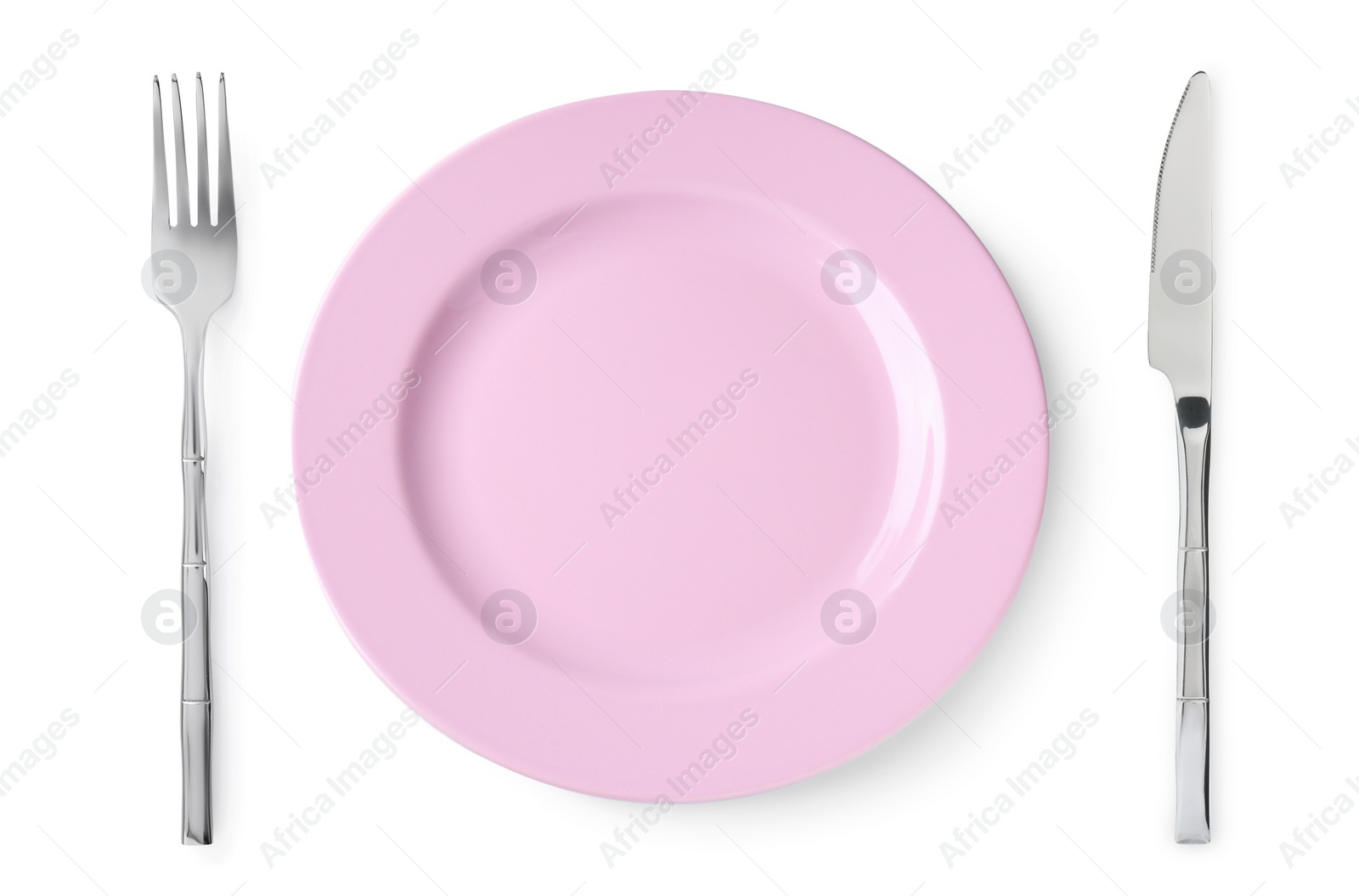 Image of Empty pink plate with fork and knife on white background, top view