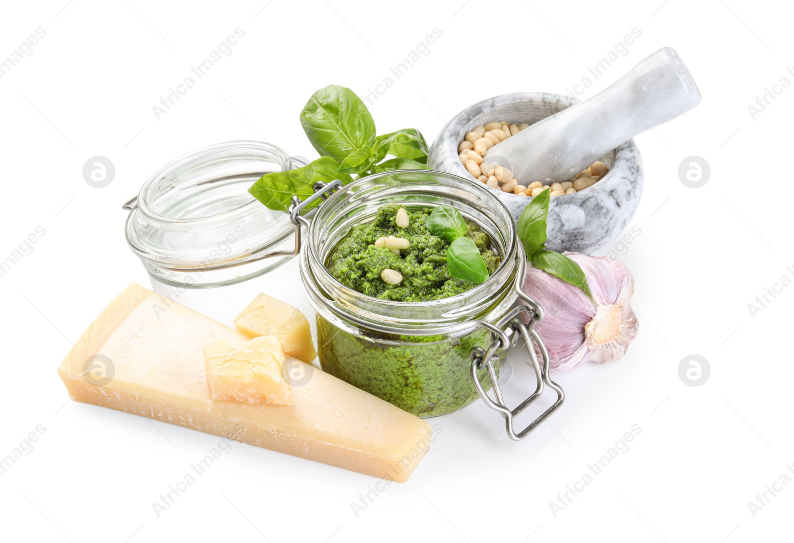 Photo of Fresh tasty pesto sauce and ingredients isolated on white