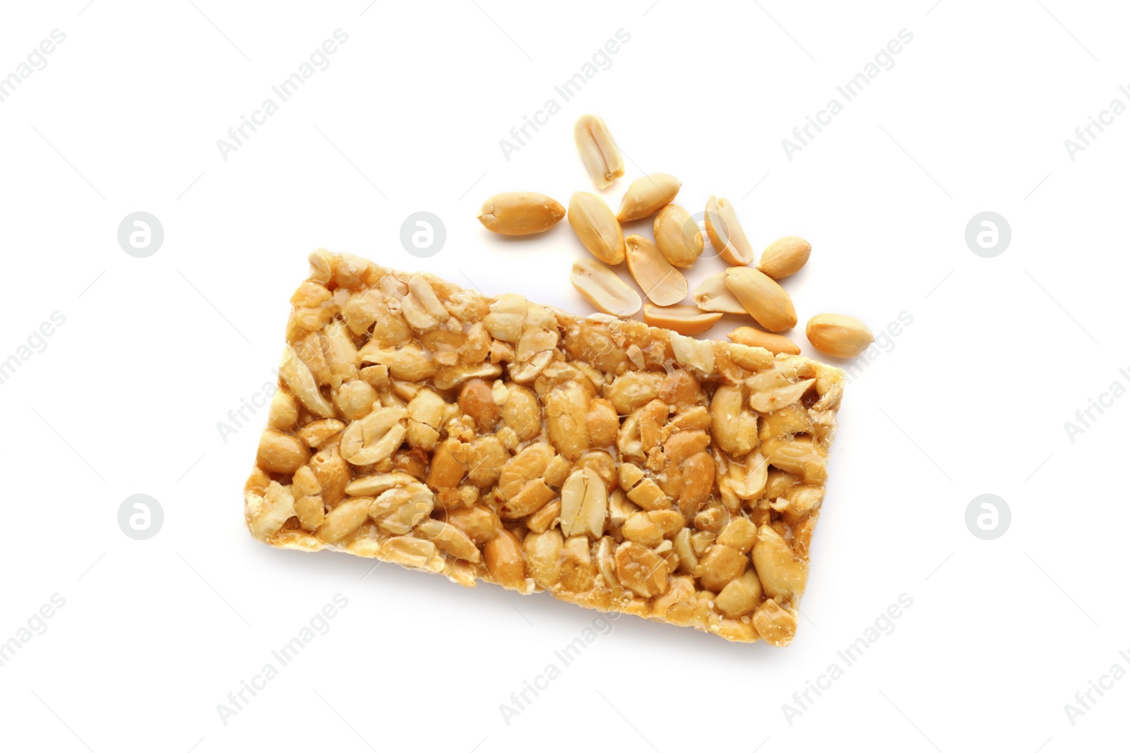 Photo of Tasty kozinaki bar and peanuts isolated on white, top view