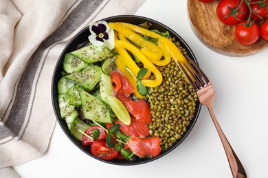 Photo of Bowl of salad with mung beans on white table, flat lay