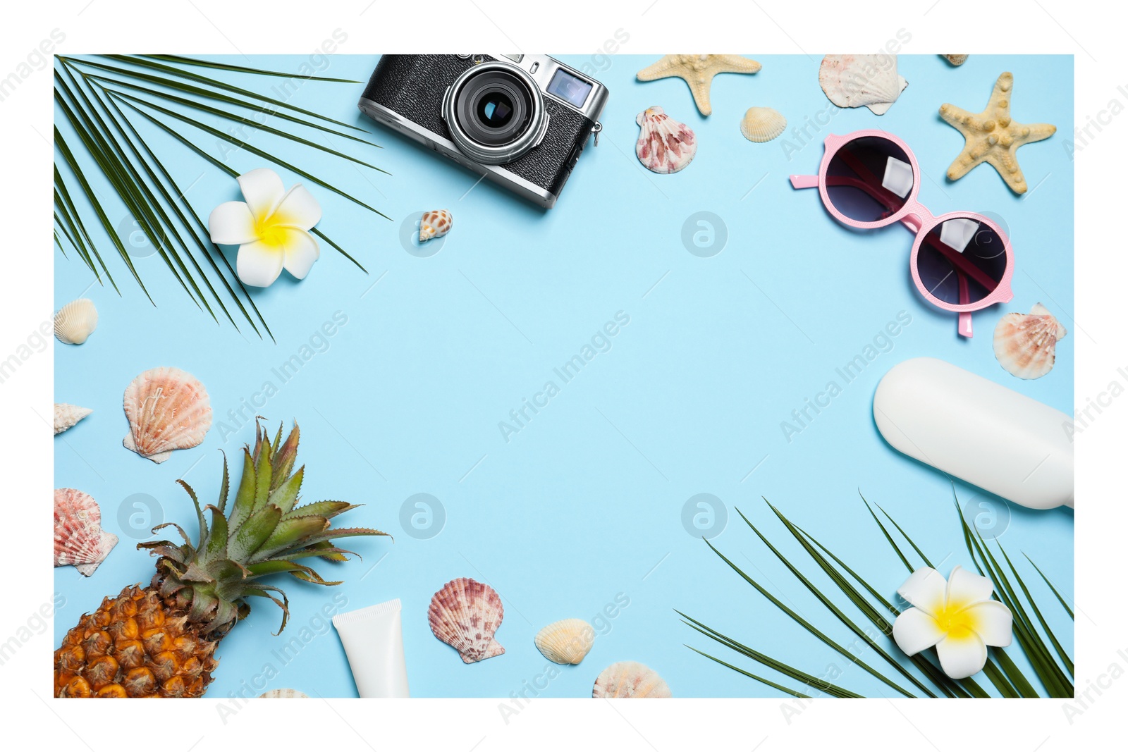 Image of Paper photo. Flat lay composition with beach accessories on light blue background