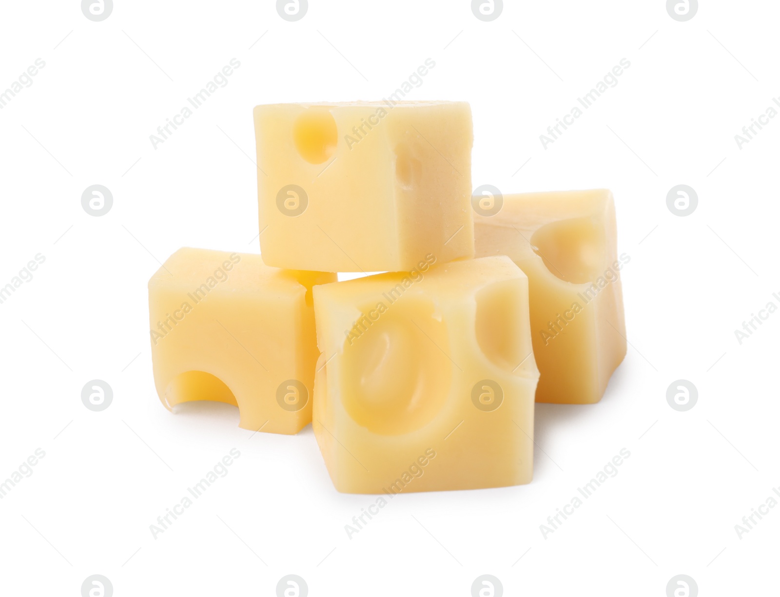 Photo of Cubes of delicious cheese isolated on white