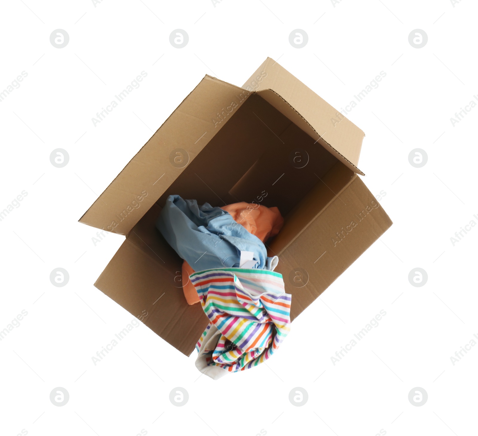 Photo of Overturned cardboard box with clothes isolated on white