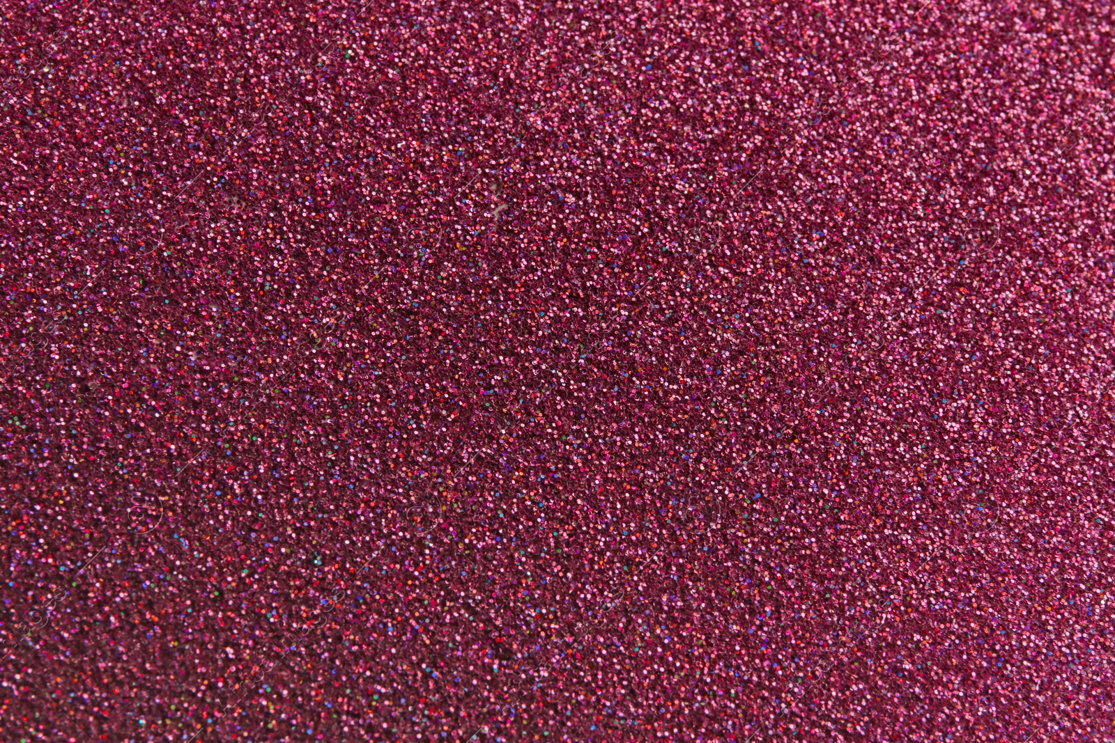 Photo of Closeup view of sparkling pink glitter background