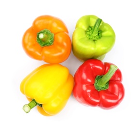 Fresh ripe bell peppers on white background, top view