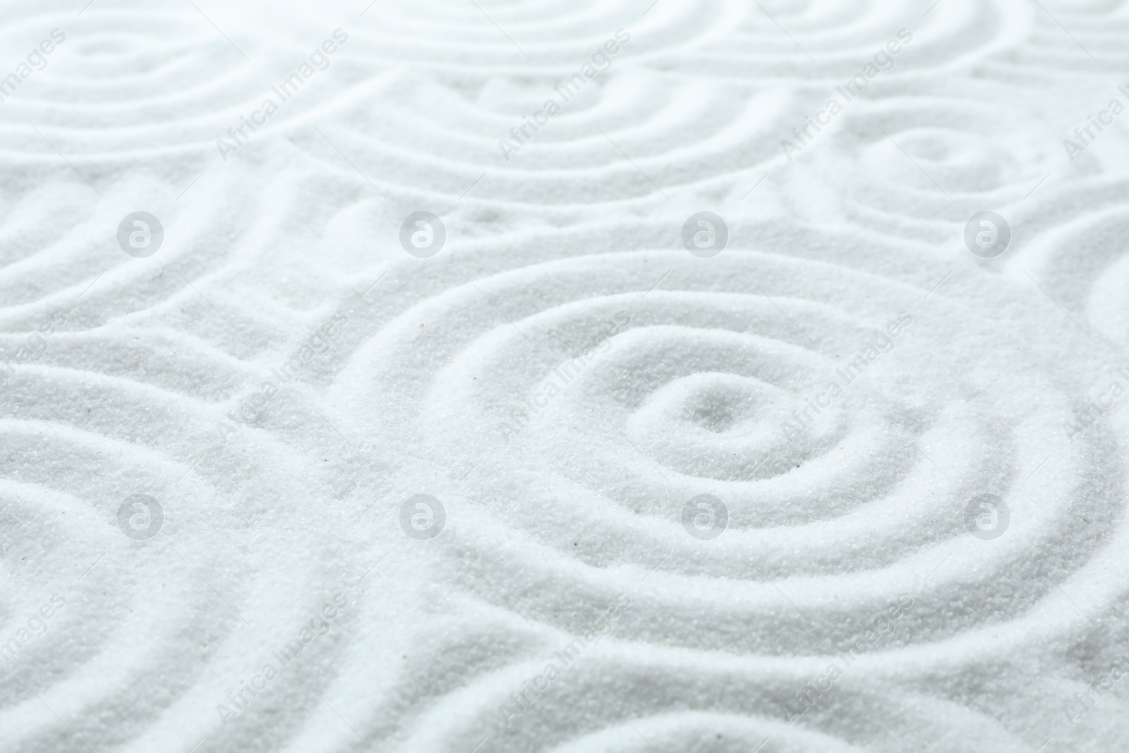 Photo of White sand with pattern as background. Zen, meditation, harmony