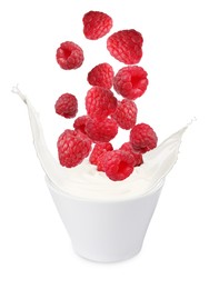 Image of Delicious ripe raspberries falling into bowl with yogurt on white background