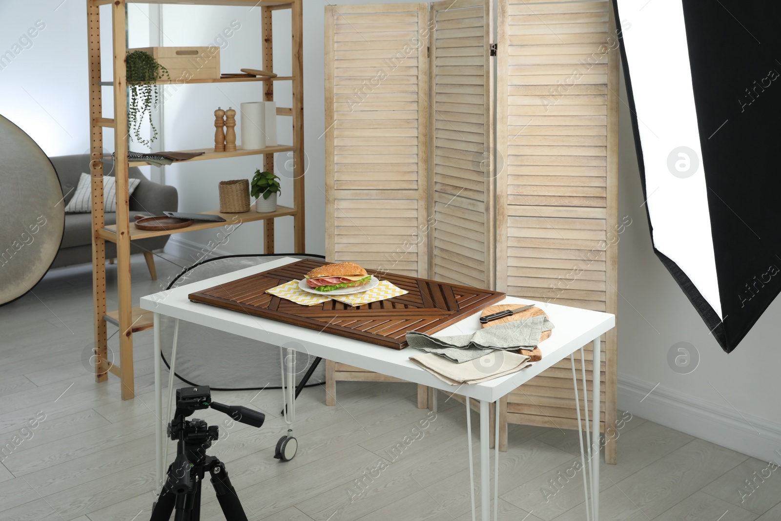 Photo of Tasty sandwich on table in photo studio. Food photography