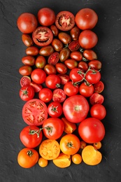 Photo of Flat lay composition with fresh ripe tomatoes on black background
