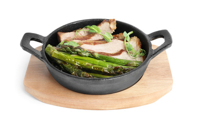 Photo of Tasty meat with asparagus and sprouts in portioned frying pan isolated on white