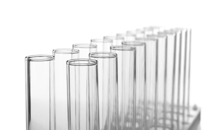 Photo of Empty test tubes on white background. Laboratory analysis equipment