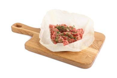 Photo of Wooden board with cooked leaf and meat filling isolated on white. Stuffed cabbage rolls