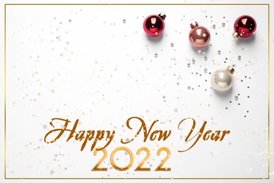 Image of Happy New 2022 Year! Beautiful baubles and confetti on white background, top view 